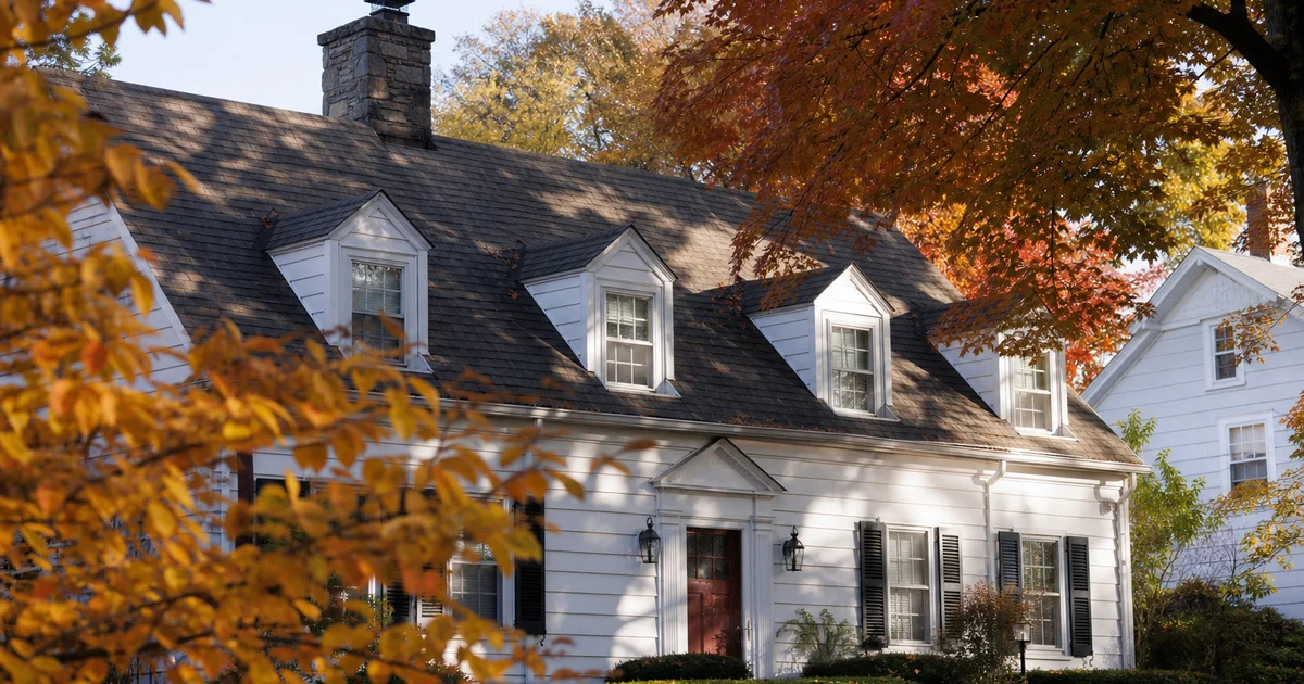 Mature asphalt shingle roof on a Hartford County colonial home in autumn